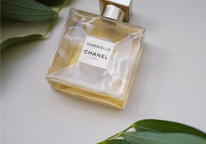 Elegant glass perfume bottle with golden cap from Chanel